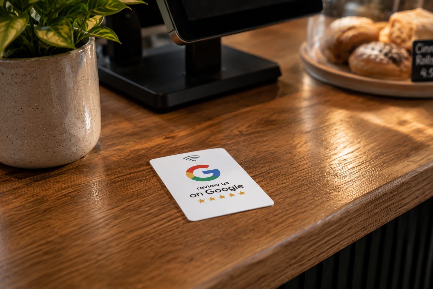W2 Reviews Google review NFC plaque on a cafe counter